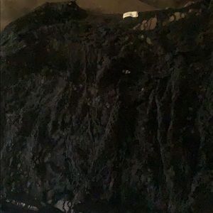 It’s a black lace shirt that is see through